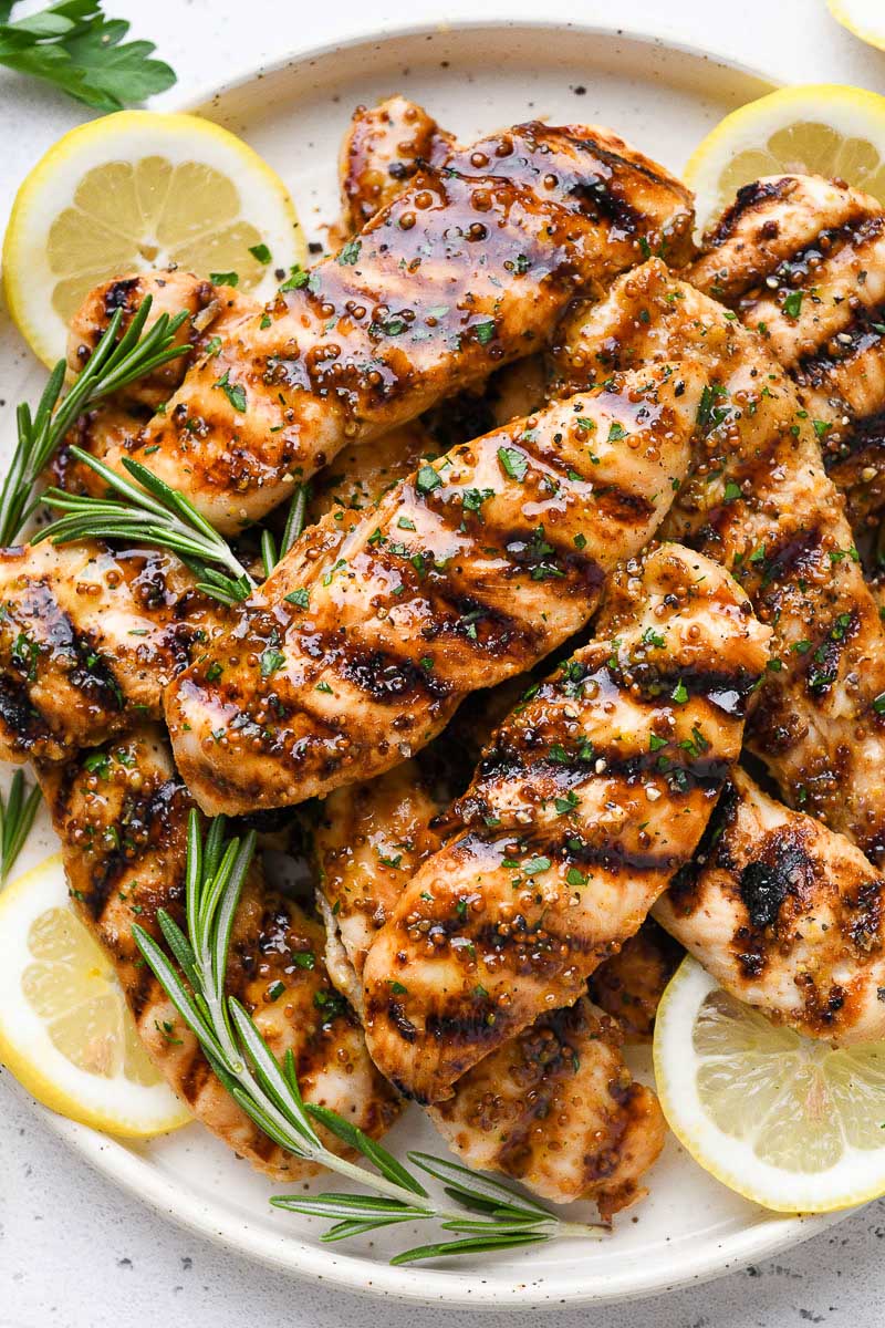 Close up of a plate of grilled honey mustard chicken.