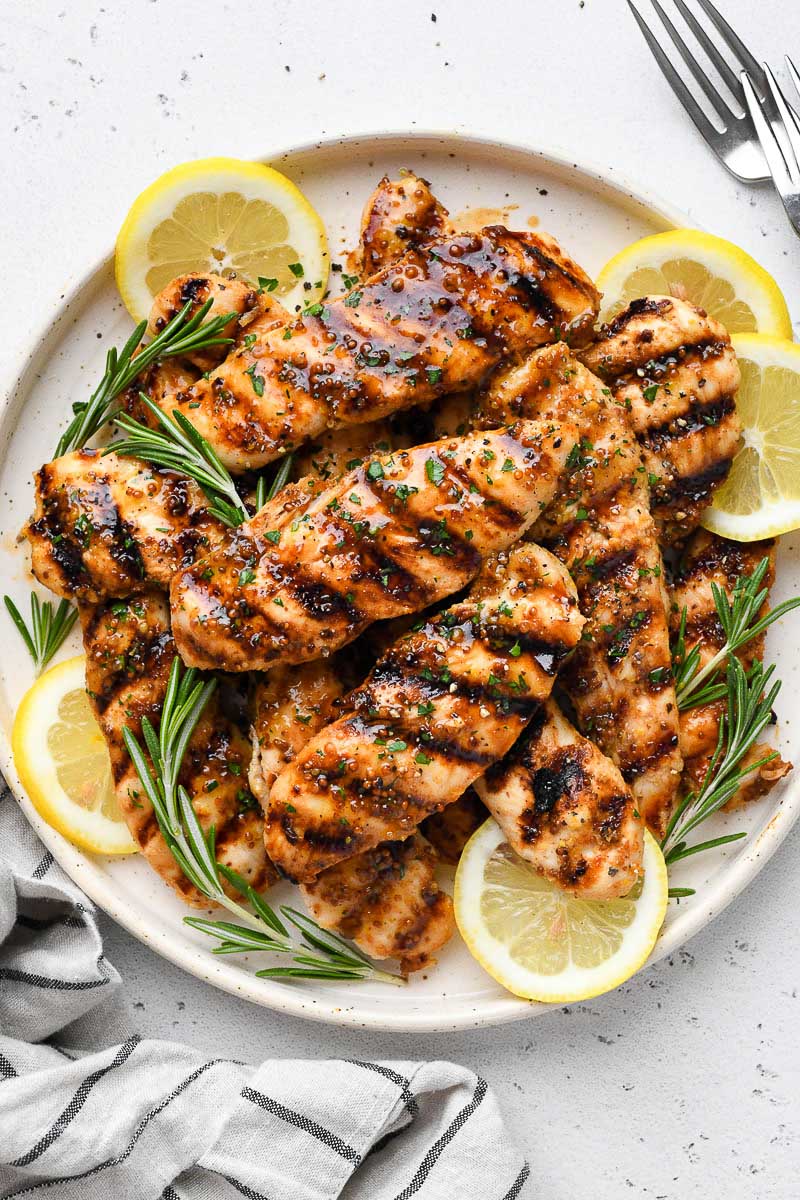 Overhead view of a plate of grilled honey mustard chicken.