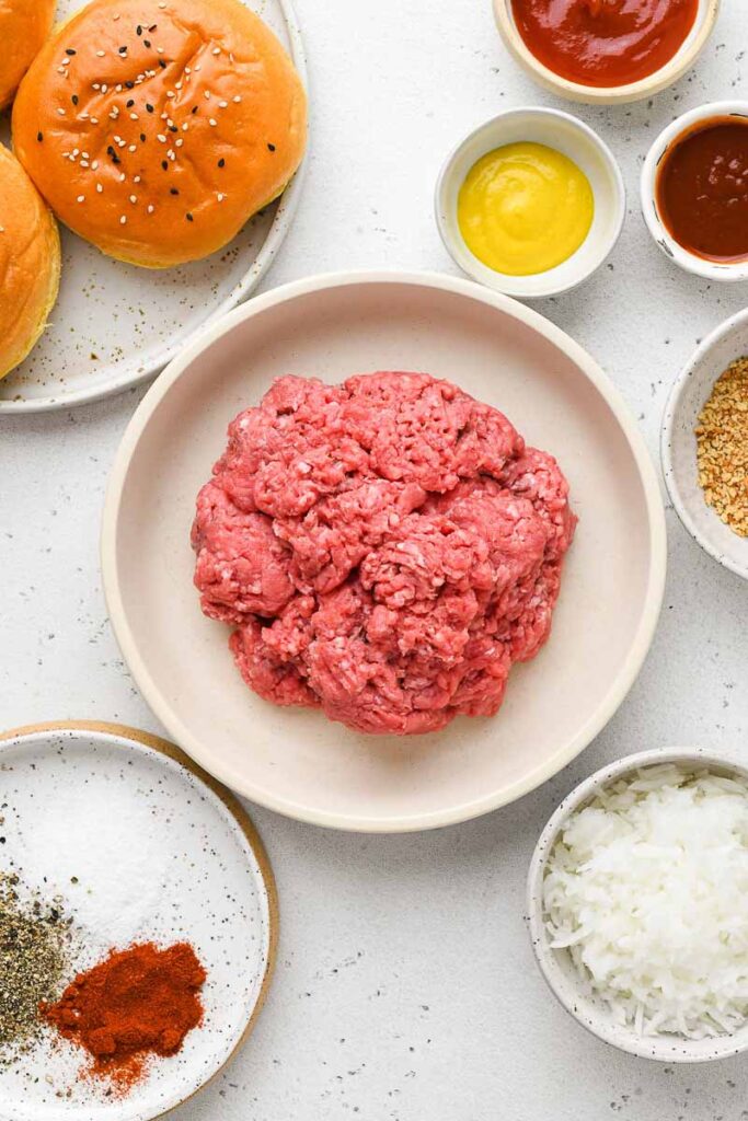 Ingredients needed to make homemade burgers.