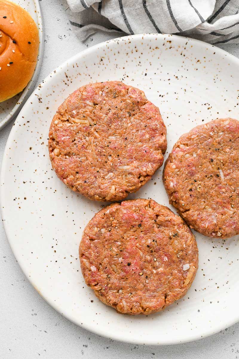 Beef patties on a plate.