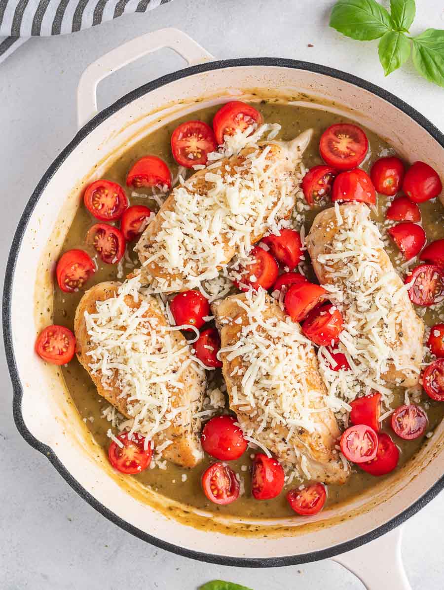 cheese toped on the chicken Margherita in a skillet