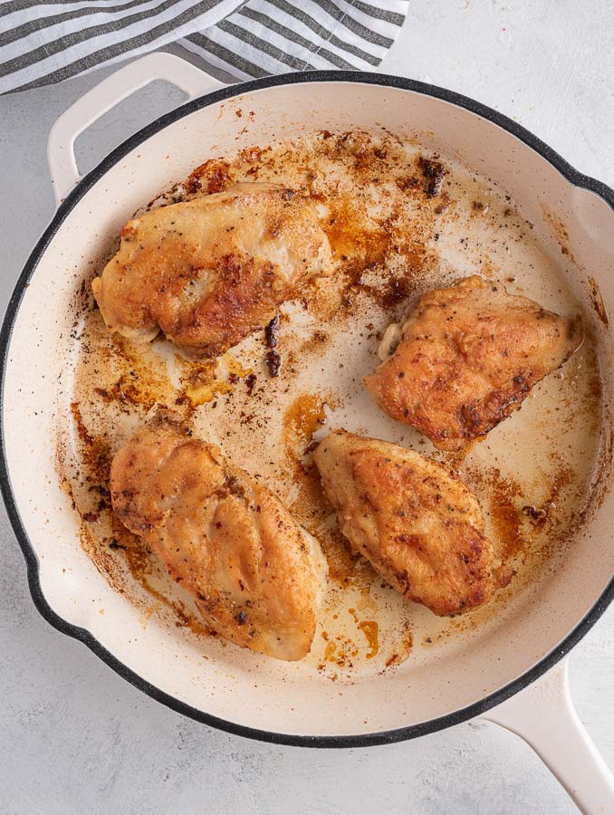 pan seared chicken in a skillet