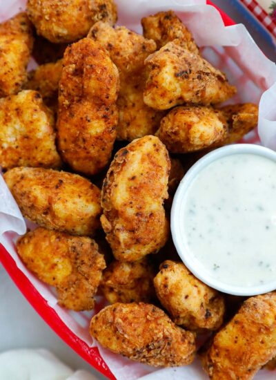 chicken bites in a red basket with a side of ranch