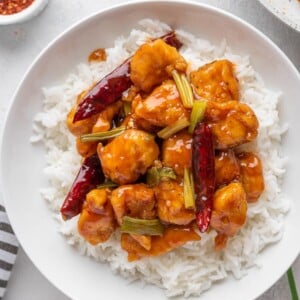 Mongolian Chicken served over white rice in a bowl