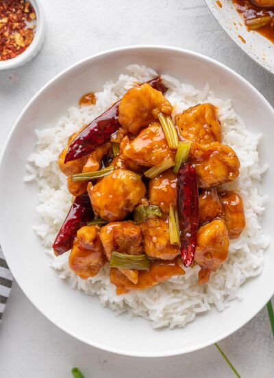 Mongolian Chicken served over white rice in a bowl