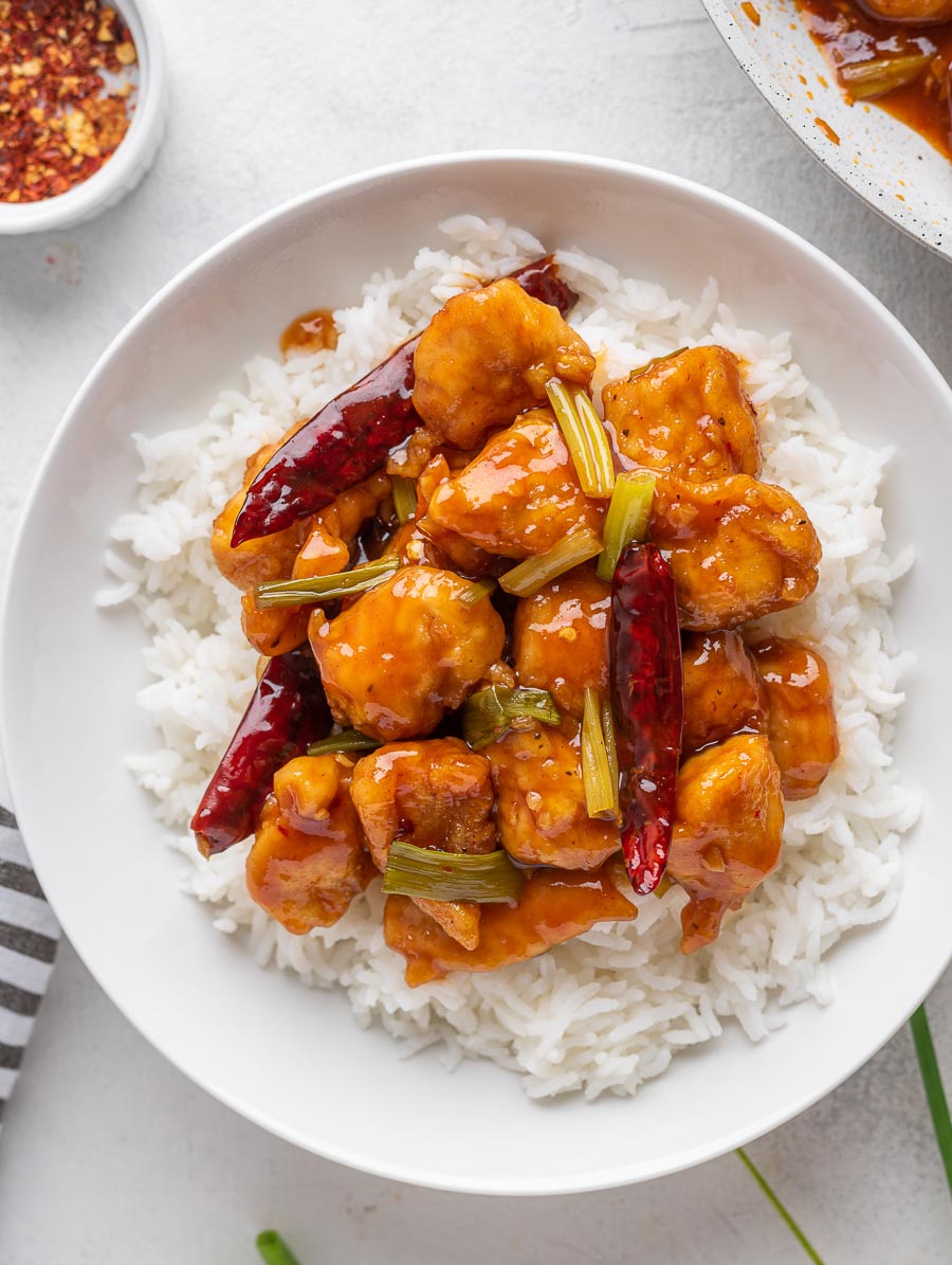 Mongolian Chicken served over white rice in a bowl