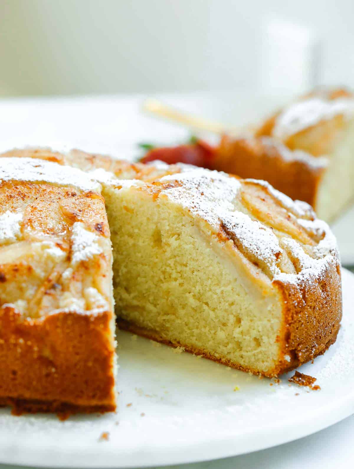 close up shot showing the inside of the pear cake where a piece was cut out from.