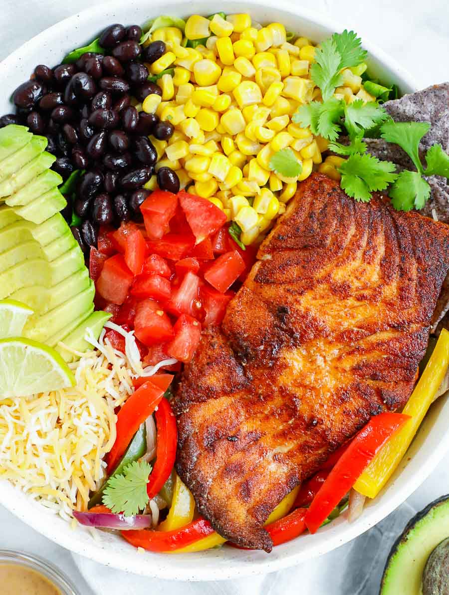 ingredients of spicy salmon salad placed in a bowl