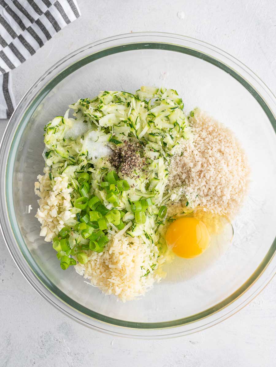 ingredients of the zucchini fritter in a bowl