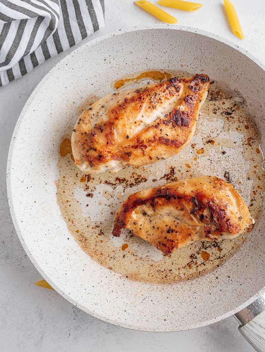 cooked chicken breast on a skillet