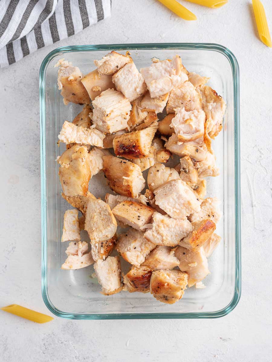 cubed chicken in a glass bowl