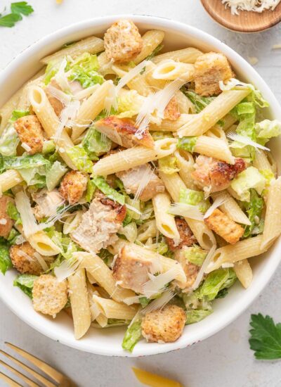 chicken ceasar pasta salad in a white bowl