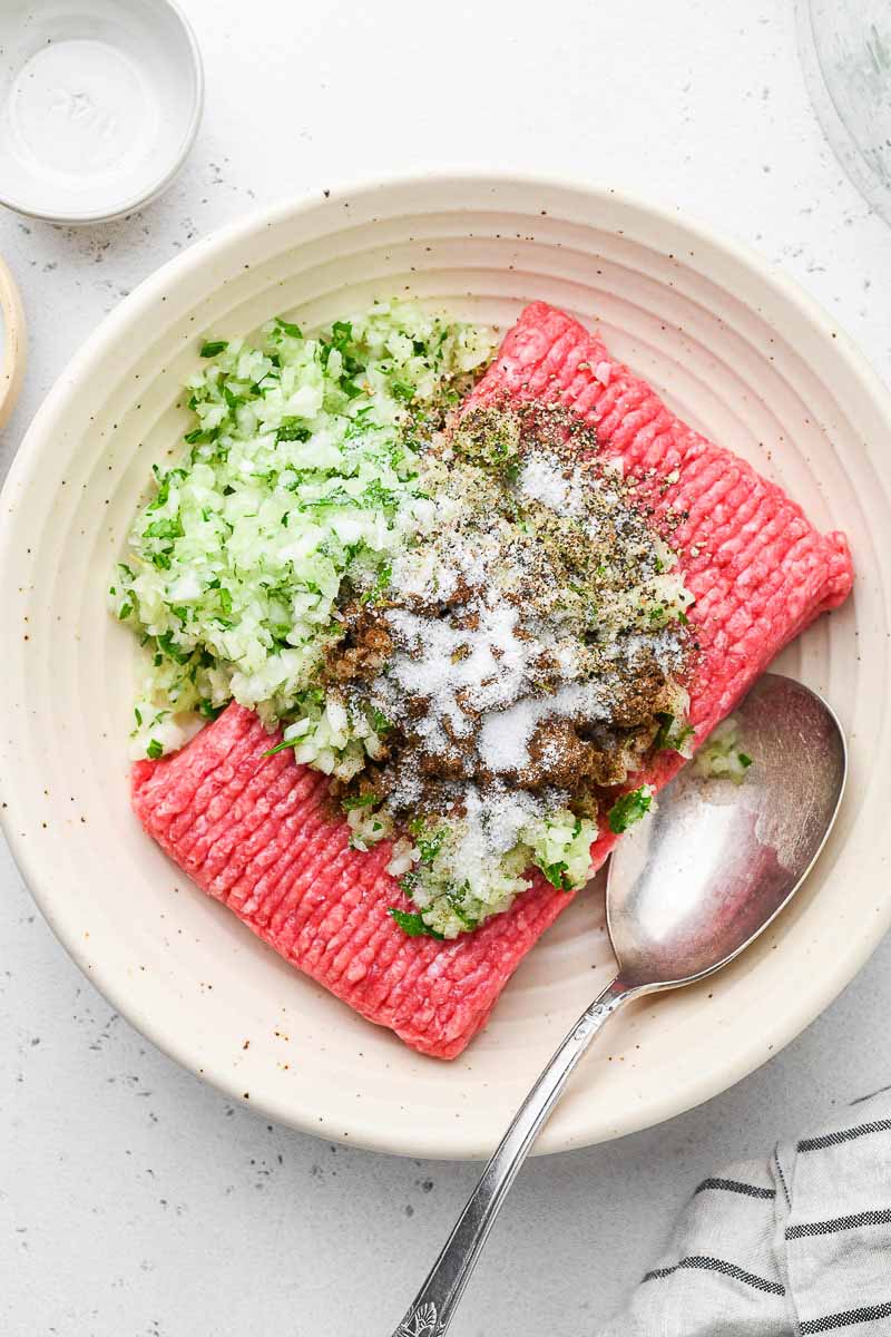 ingredients of the beef kofta in a plate before mixing