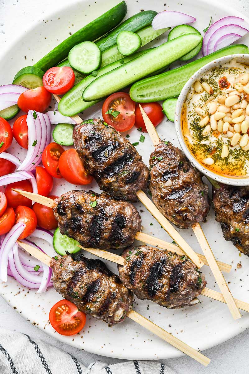 top down close up shot of the beef kofta on a plate with sides