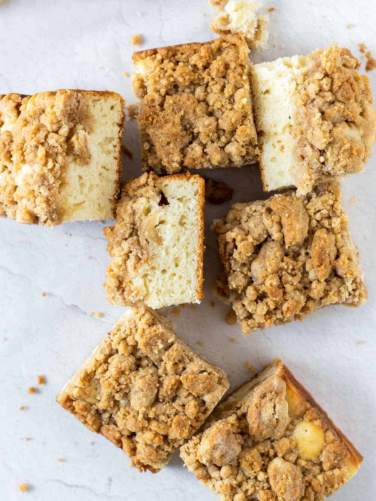 square pieces of apple crumb cake laid out.