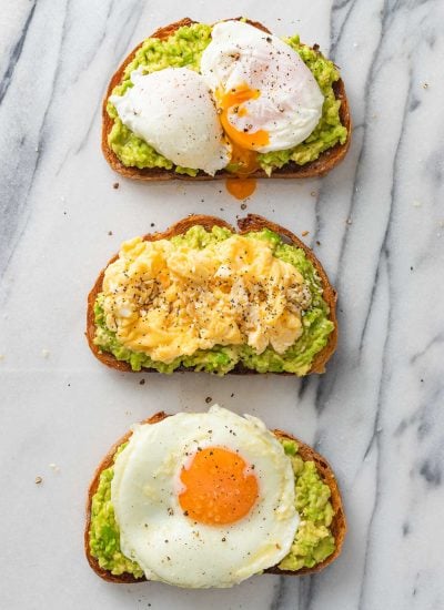 3 avocado toasts topped with fried, scrambled and pouched egg.