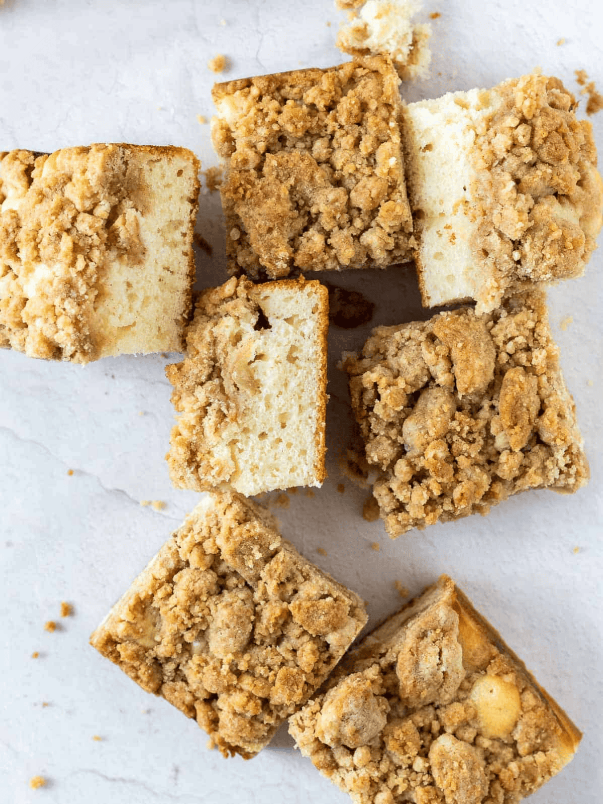 Apple Crumb Cake cut into squares with a cinnamon crumb topping.
