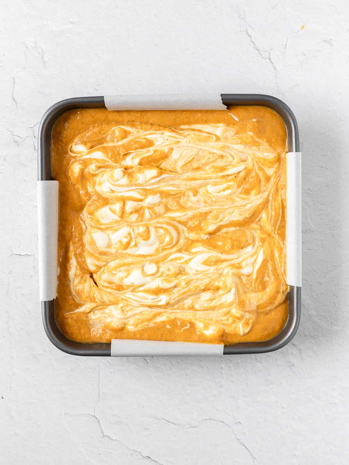 Cheesecake Swirled Pumpkin in a pan before baking