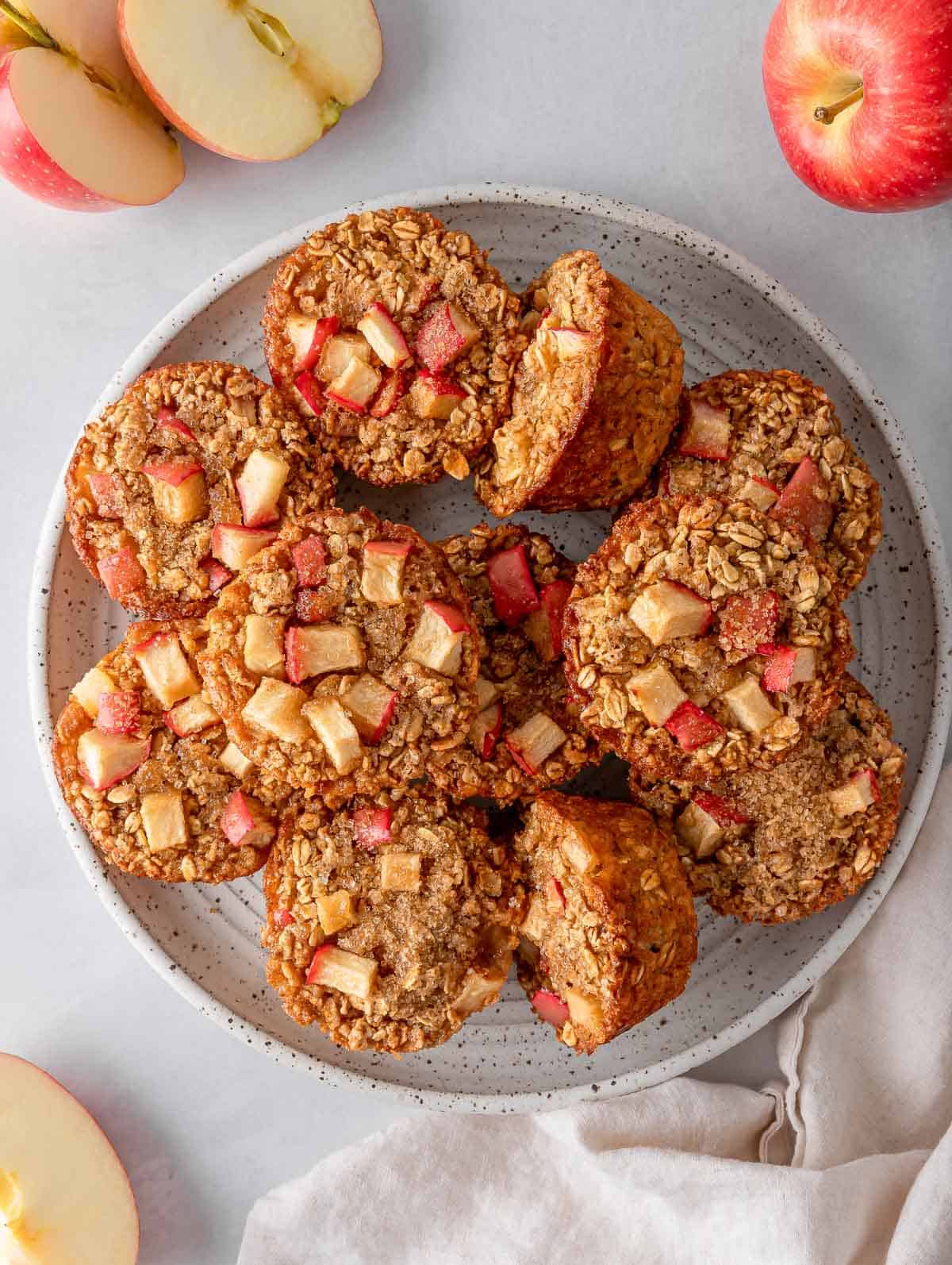 Overhead view of cinnamon baked apple oats cups on a plate.