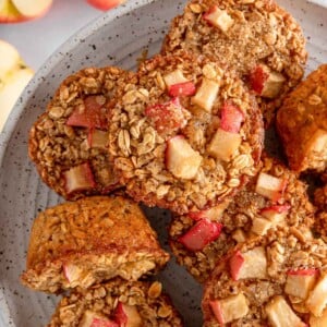 Overhead view of cinnamon baked apple oats cups on a plate.