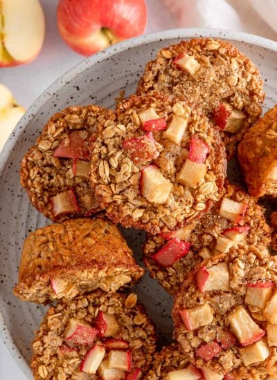 Overhead view of cinnamon baked apple oats cups on a plate.