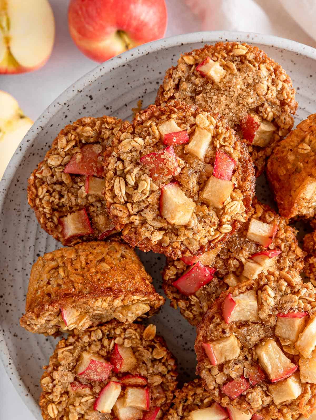 Overhead view of cinnamon baked apple oats cups on a plate.