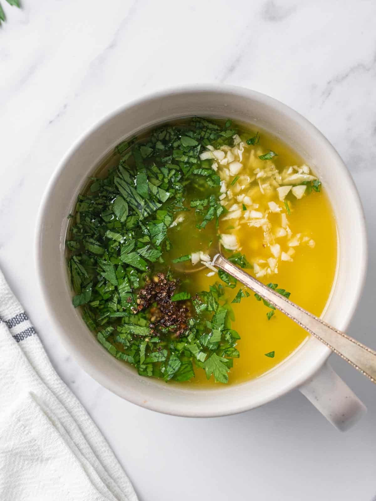 Garlic butter sauce being combined.