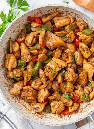 garlic butter chicken in a white skillet.