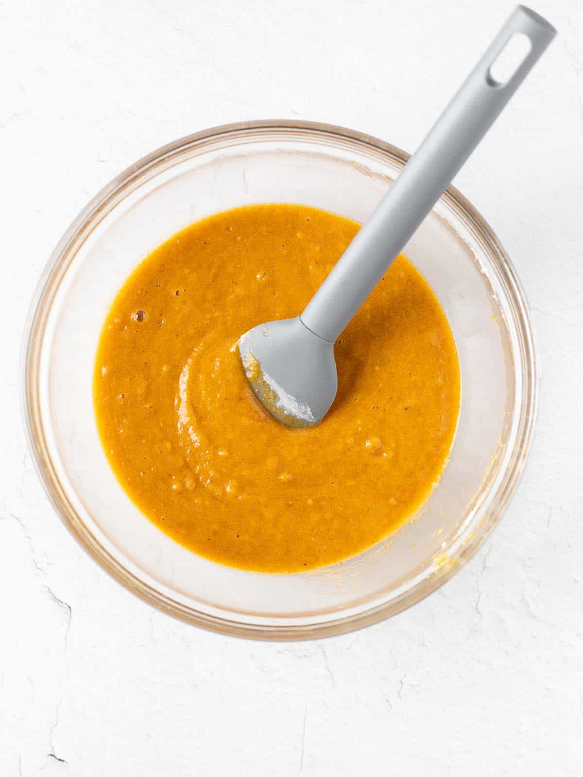 pumpkin cake roll batter in a bowl