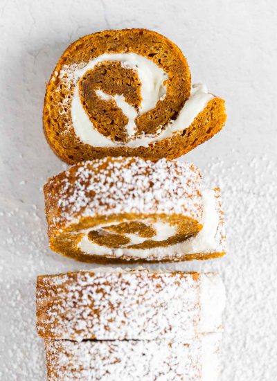 pieces of pumpkin cake roll cut out and dusted with powdered sugar