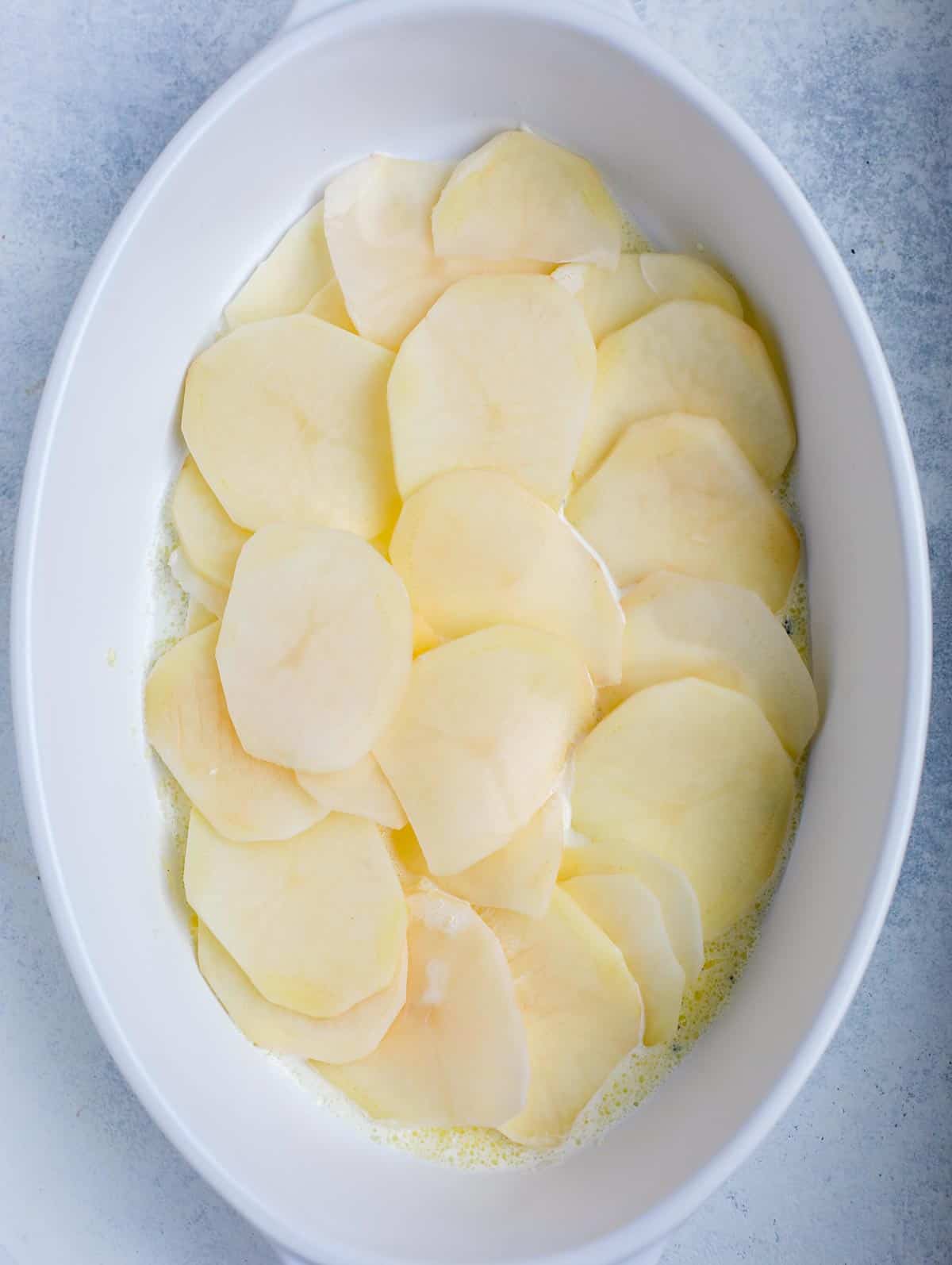 step showing how to assemble au gratin potato