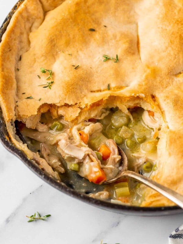 spoon in the pot pie skillet scooping the filling mixture