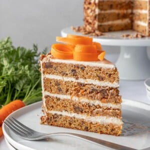 slice of carrot cake on a plate with a fork