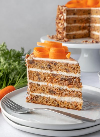 slice of carrot cake on a plate with a fork