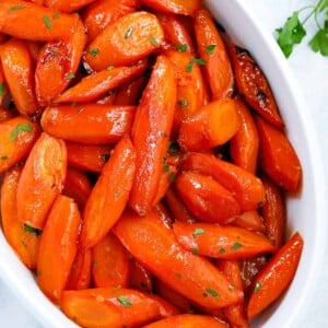 brown sugar glazed carrots in a white serving dish