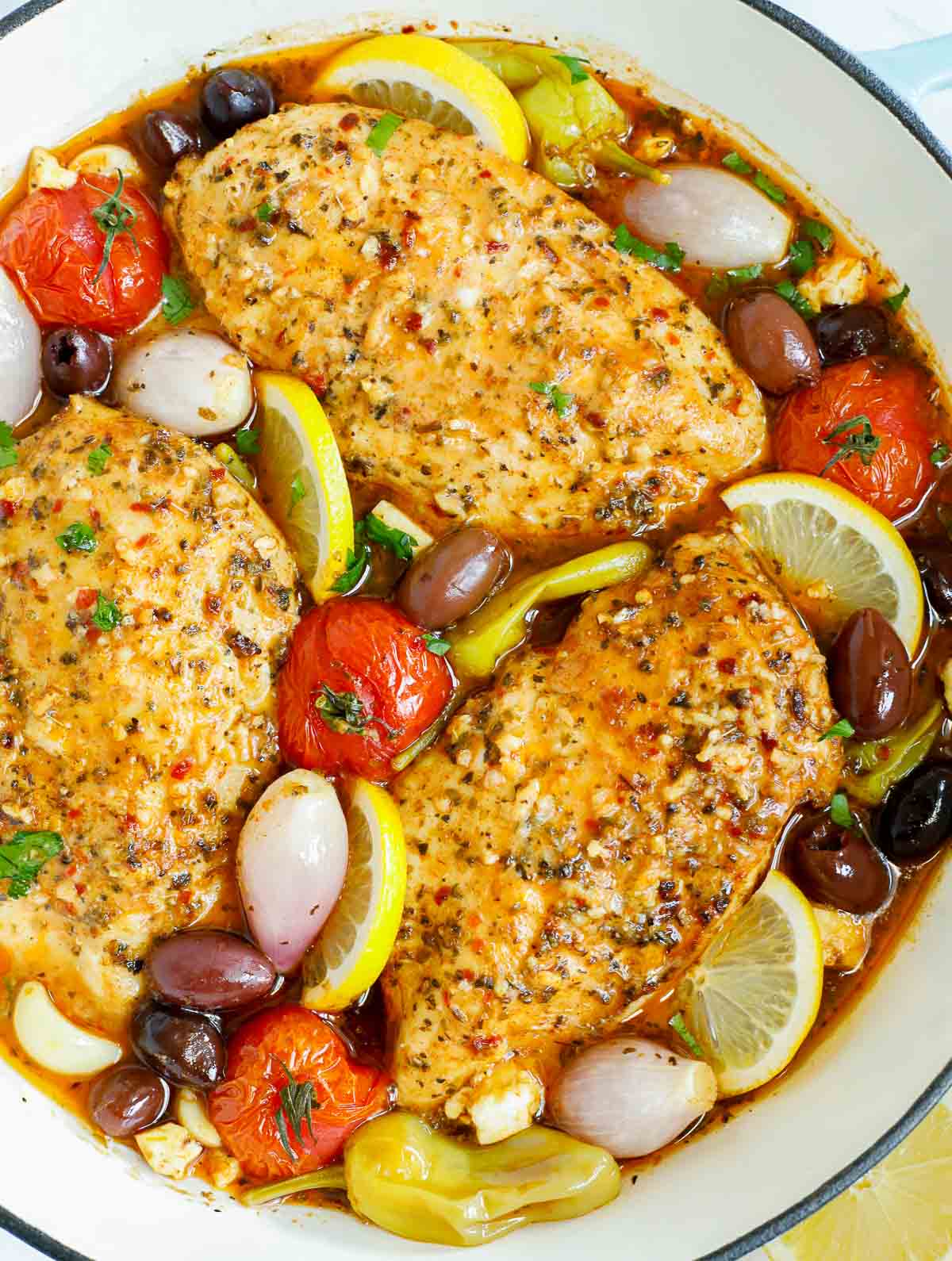 Overhead view of a pan of Greek chicken.