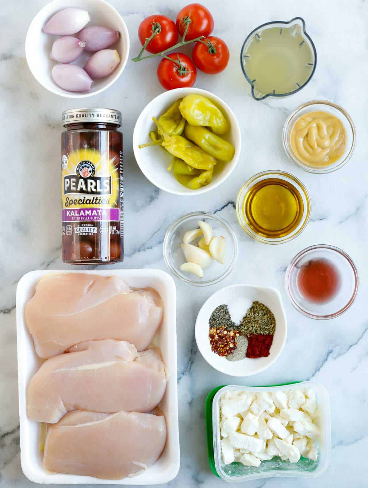 Ingredients needed to make oven baked Greek chicken.