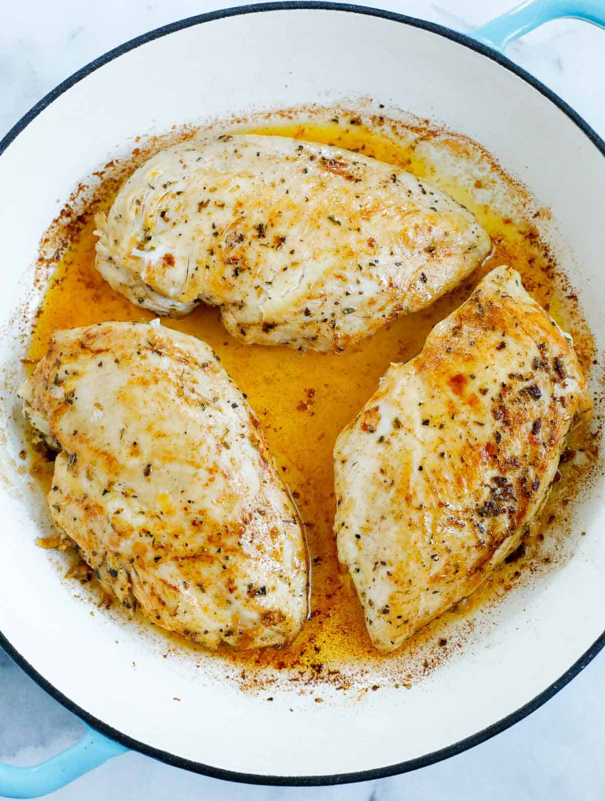 Chicken inside of a dutch oven.