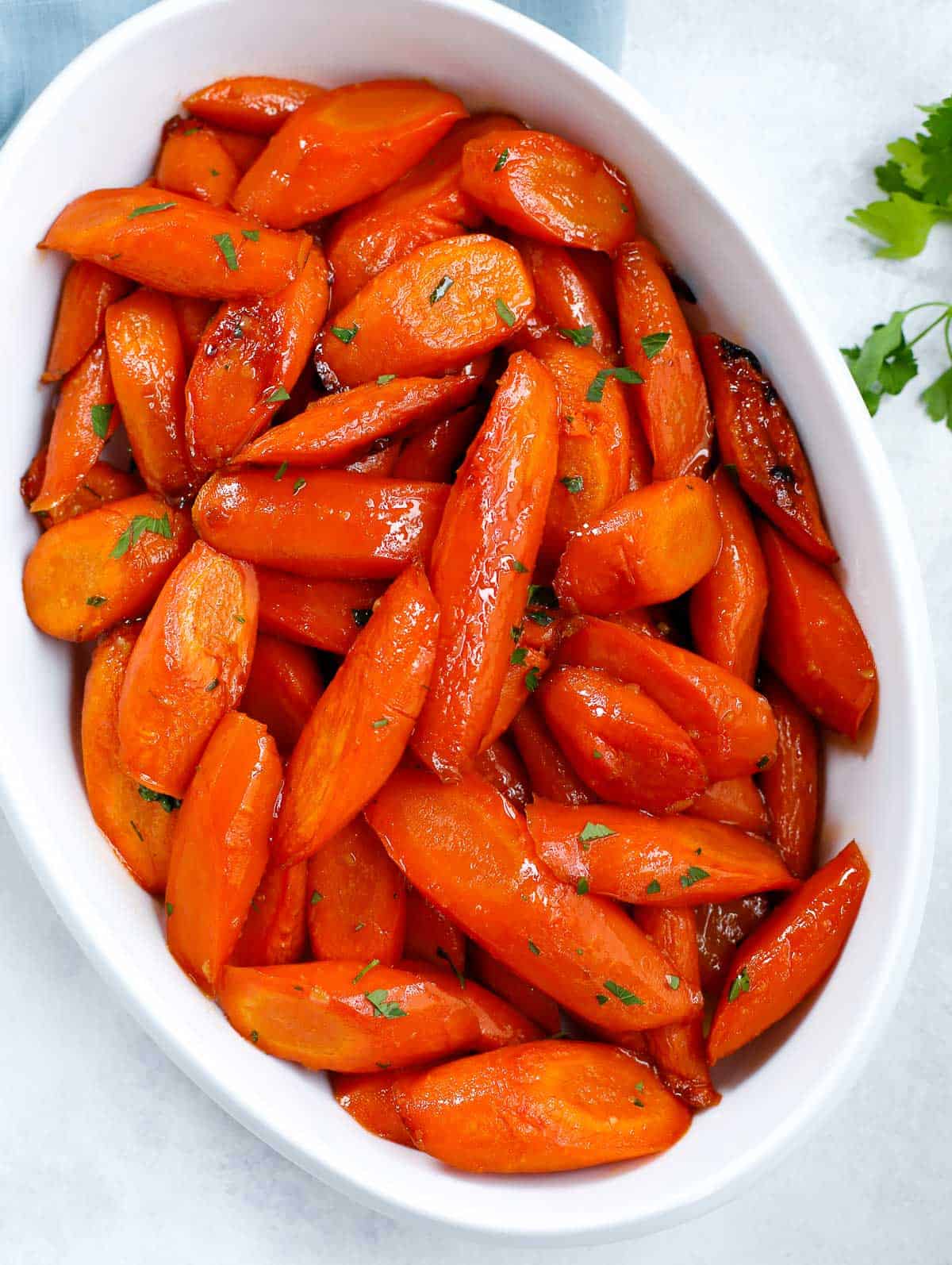 brown sugar glazed carrots on a white serving dish