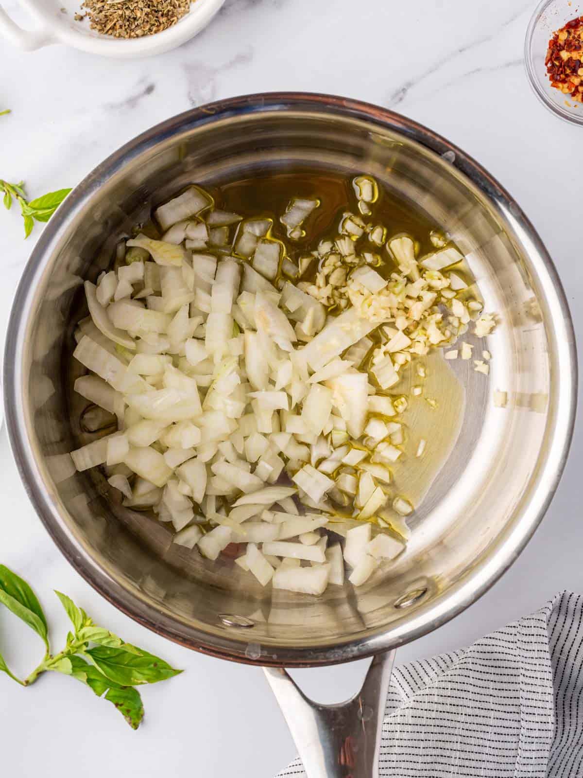 onion in the pot to make marinara sauce