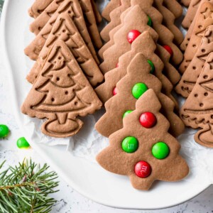 christmas tree gingerbread cookies on a white plate