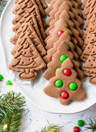 christmas tree gingerbread cookies on a white plate