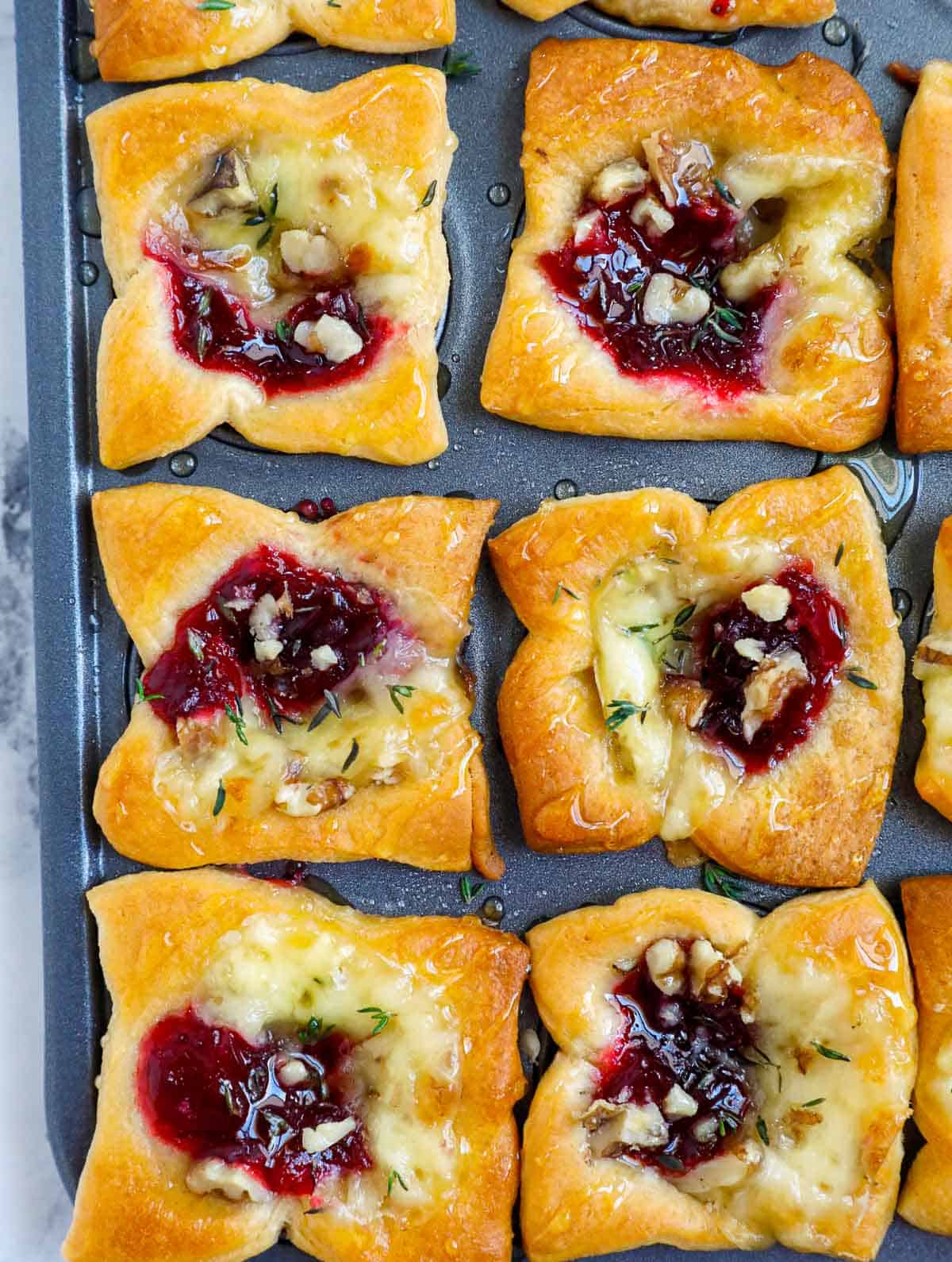 brie and cranberry bites drizzled with honey