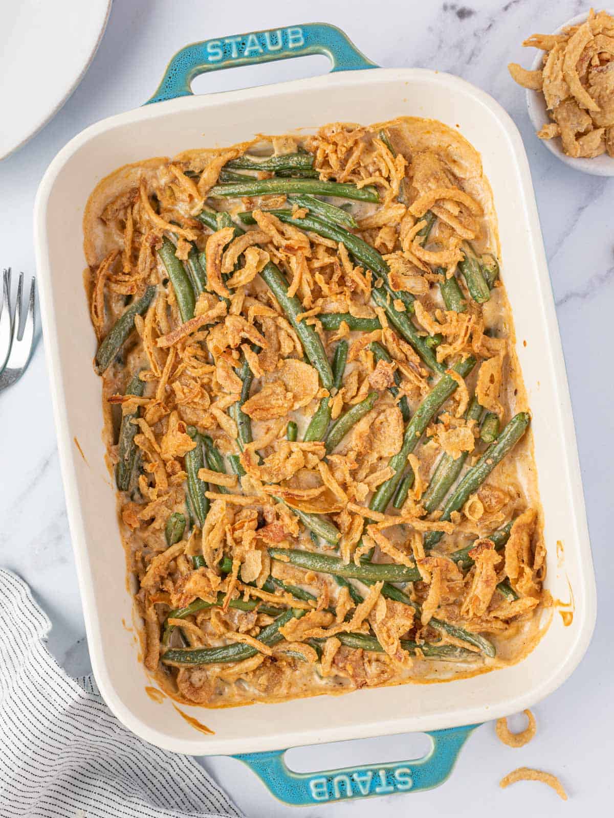 Cheesy Green Bean Casserole in white baking dish