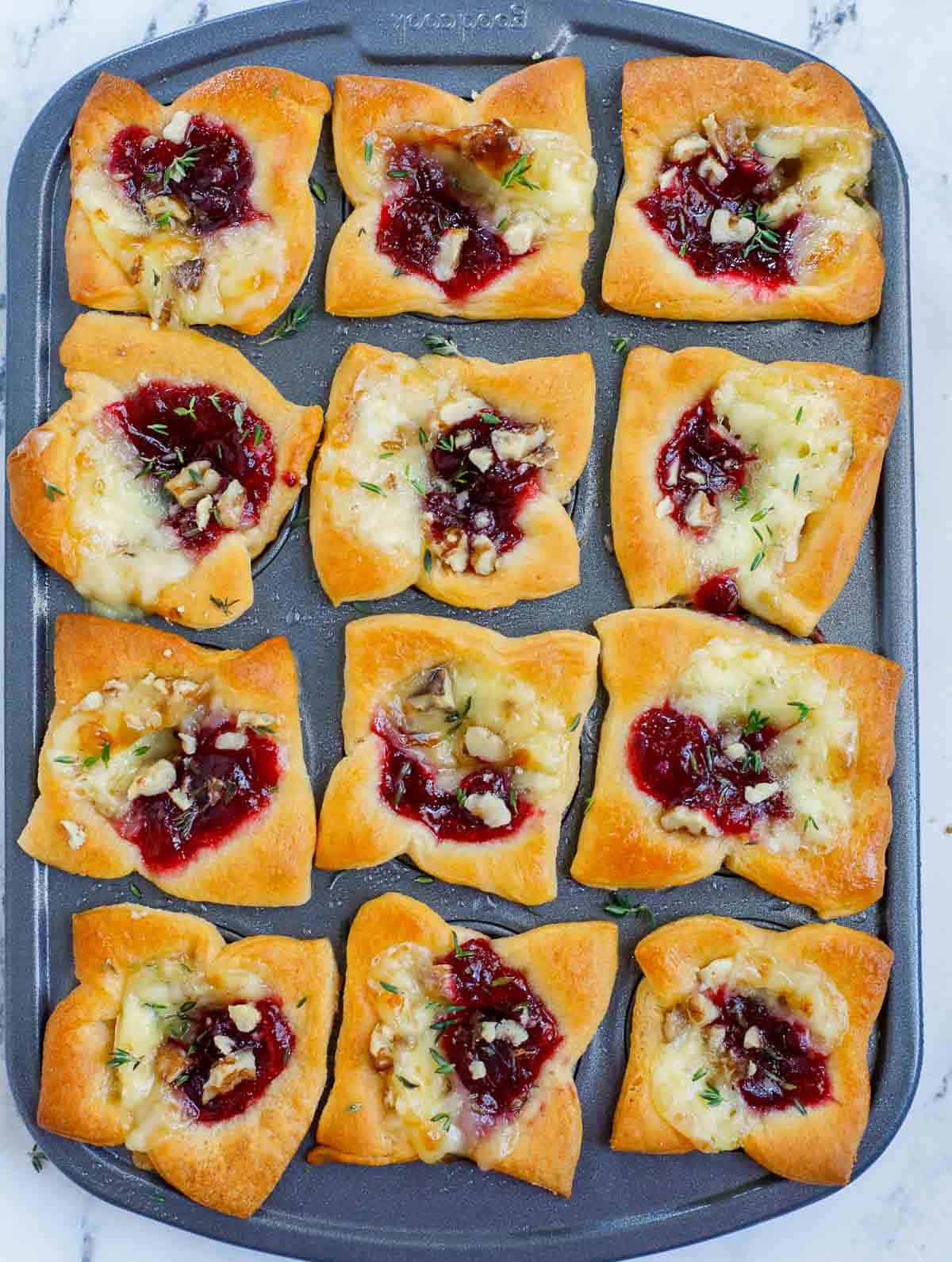 brie bites in tin pan after baking.