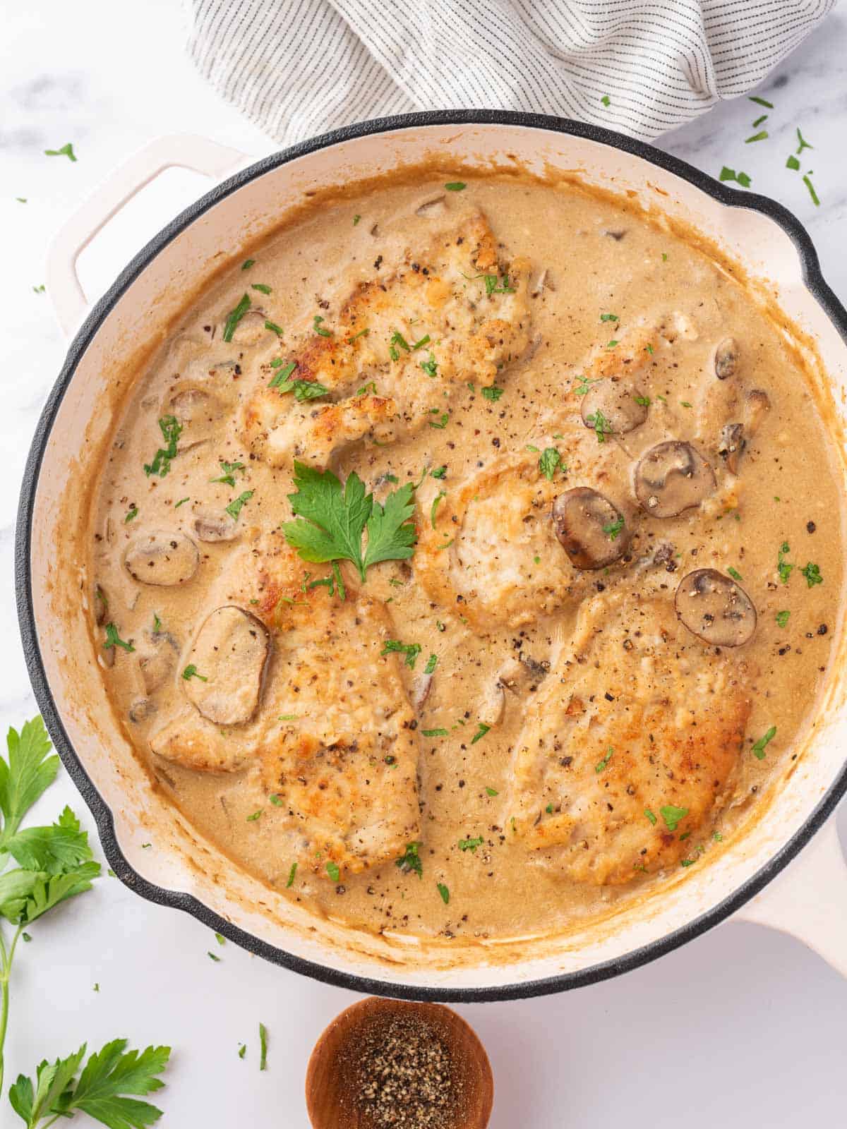 Creamy Chicken and Mushroom Stroganoff served in a skillet, topped with parsley