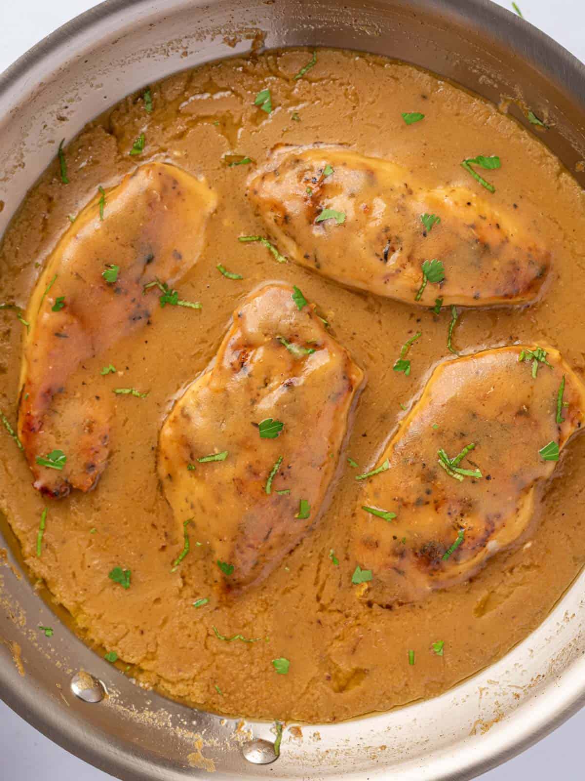 a pan of chicken and gravy.