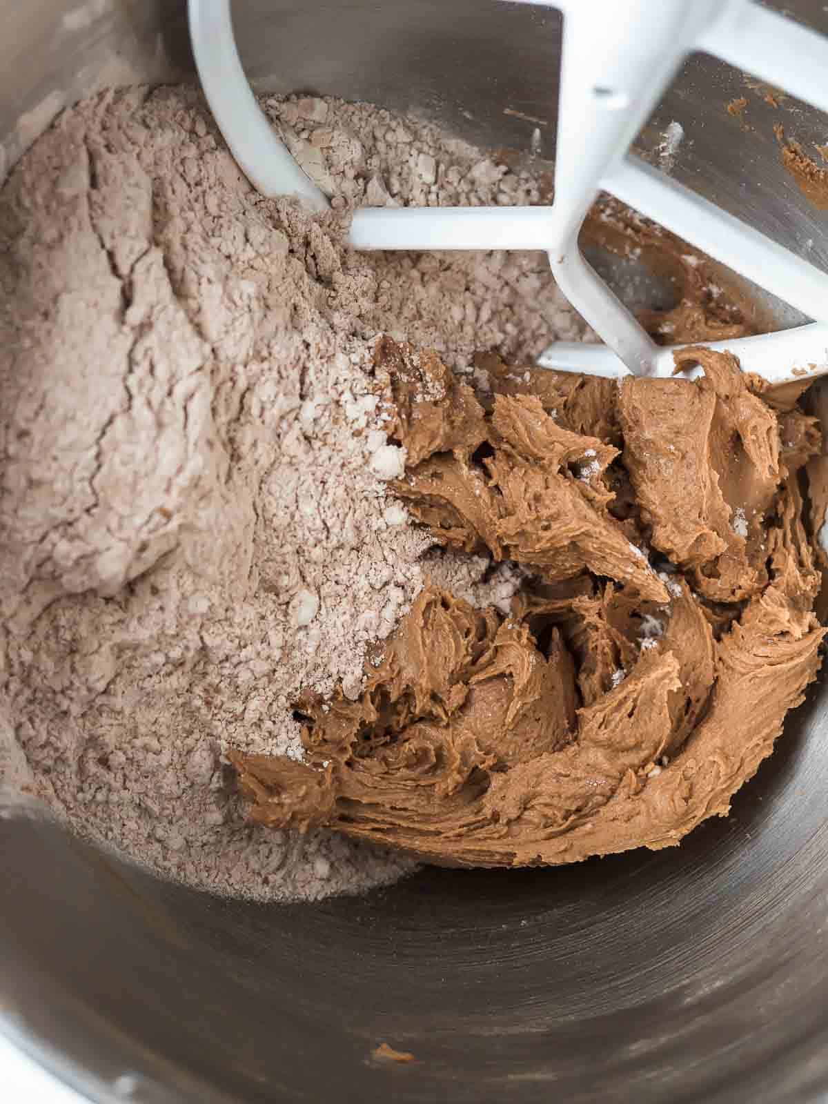 wet and dry ingredient cookie dough in a bowl