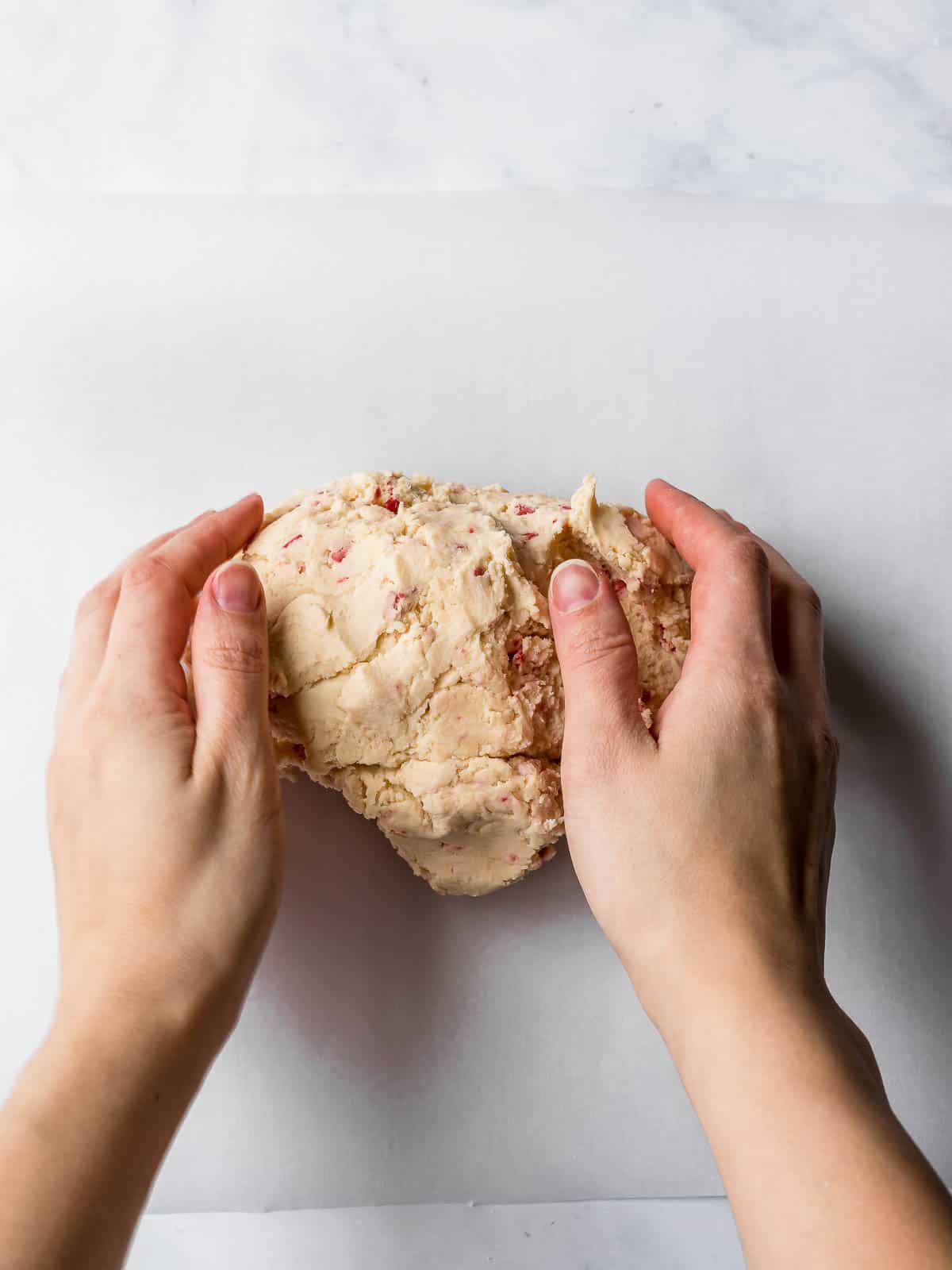 hand kneading the cookie dough