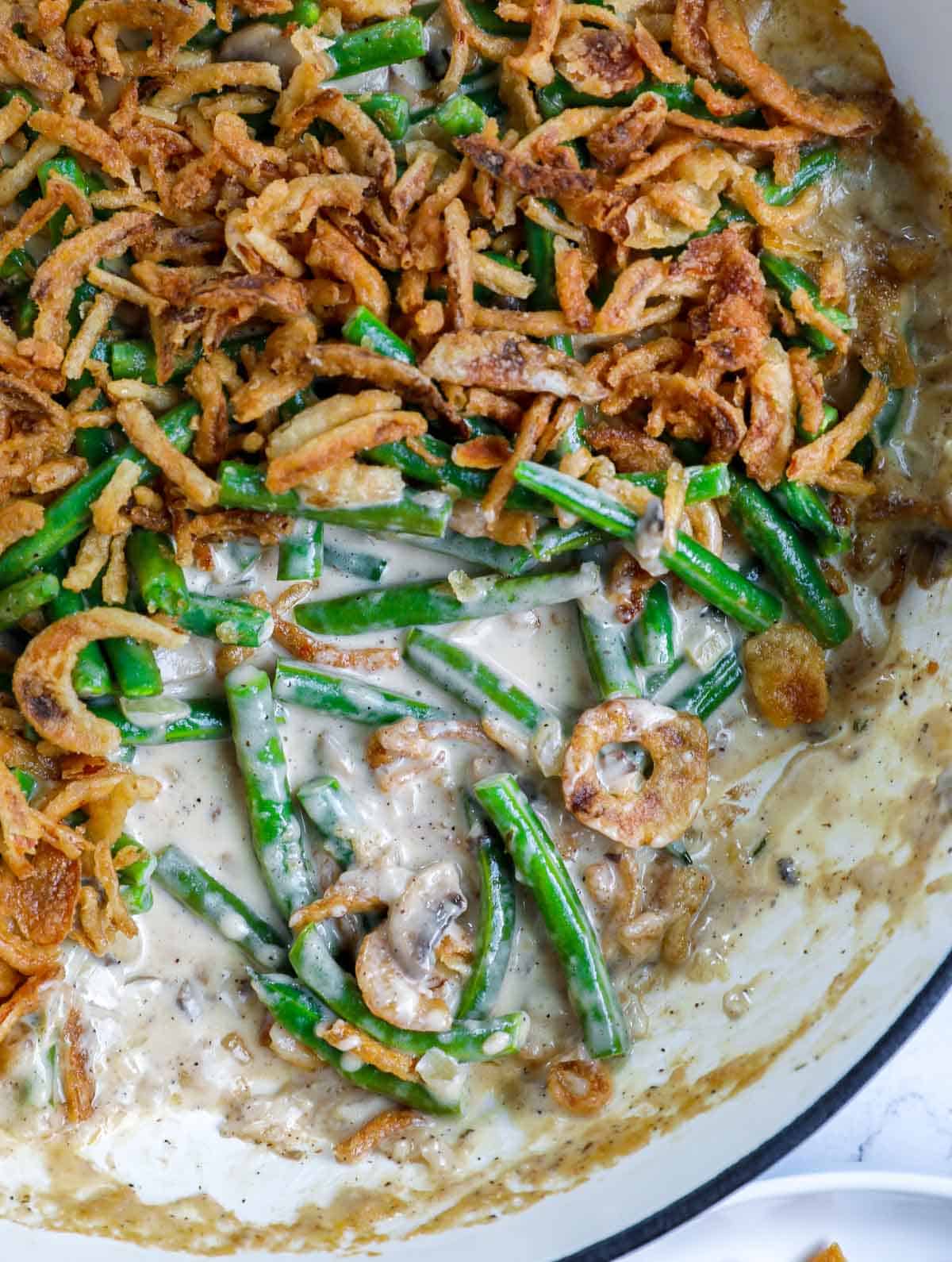 green bean casserole with a portion removed